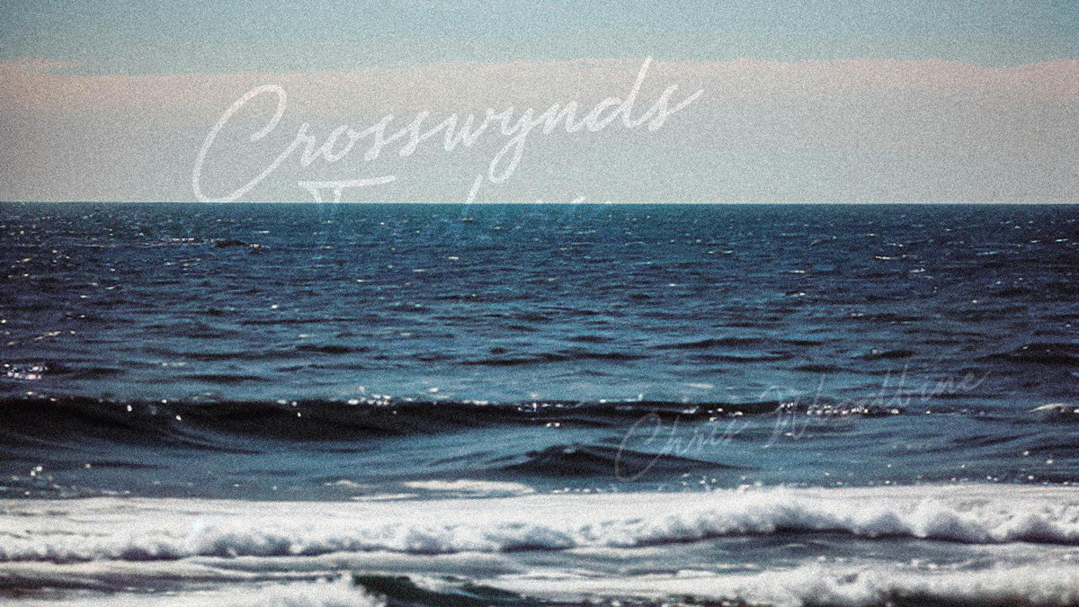 Ocean waves with 'Crosswynds' branding in the sky